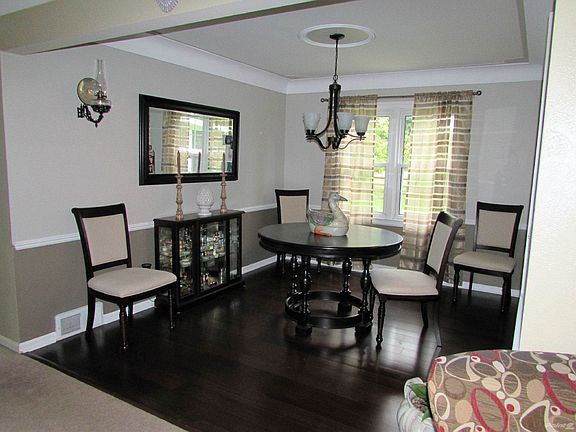 Dining Room: Today's dark wood flooring, white trim and incredible ceiling detail!