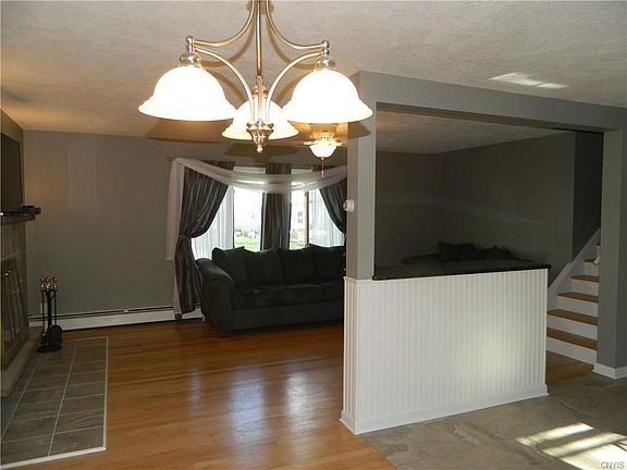 view of living room that overlooks the lake, from the dining room.
