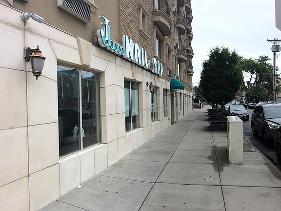 The building's commercial tenants include a manicure and ped