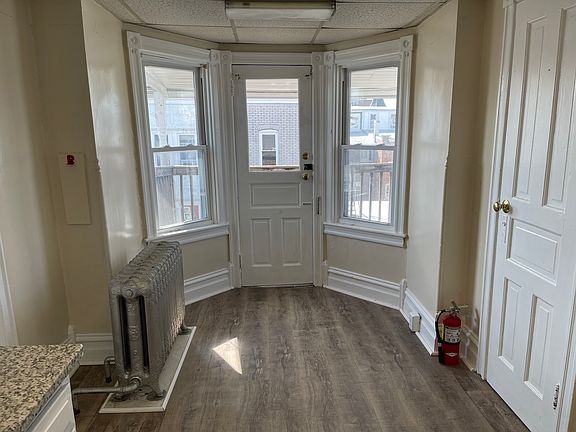 Pantry closet, space for kitchen table and door to outdoor balcony.