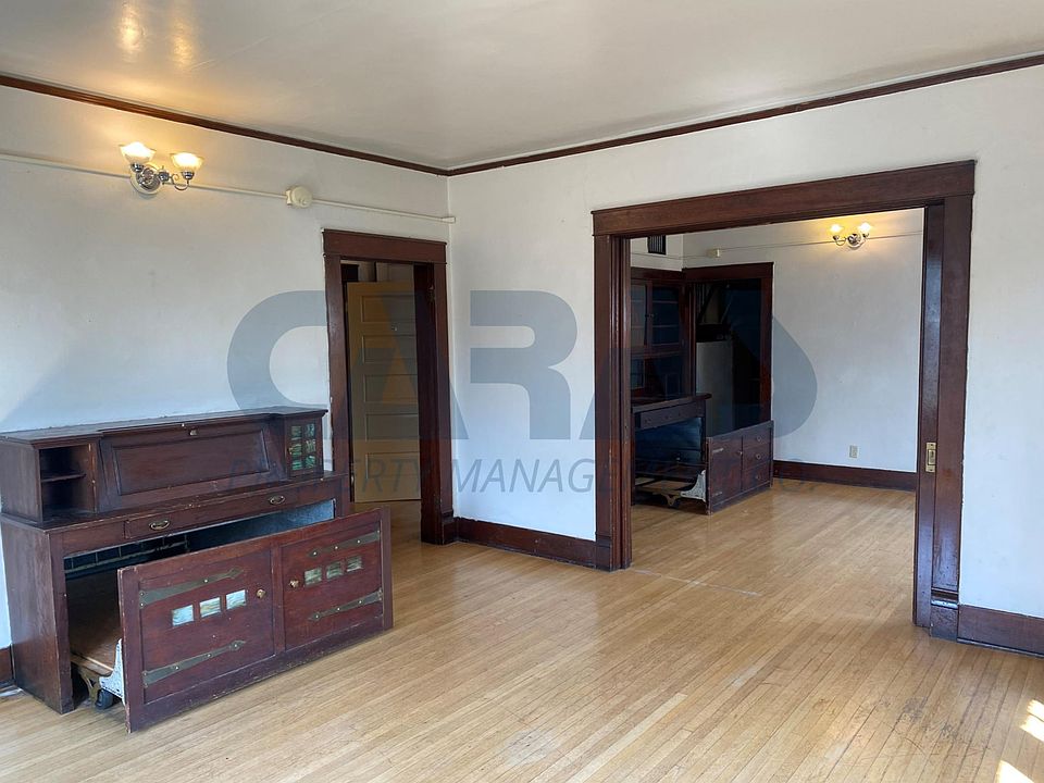 "Double Studio" dual murphy bed/storage built-ins. Hardwood flooring, period sconces, pocket doors.