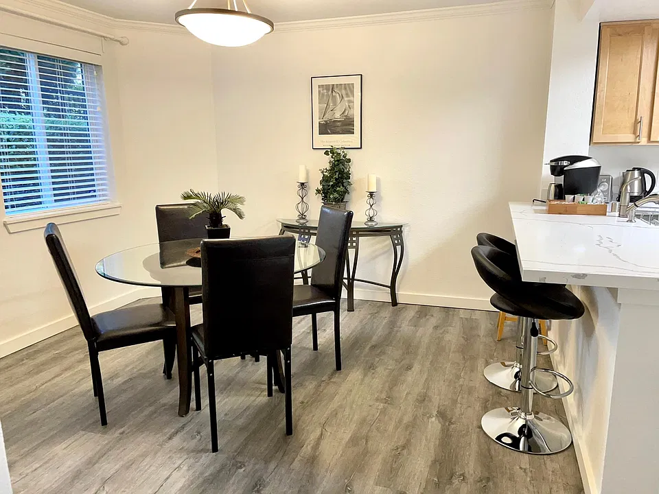 Updated kitchen with a large dining room and eating bar.