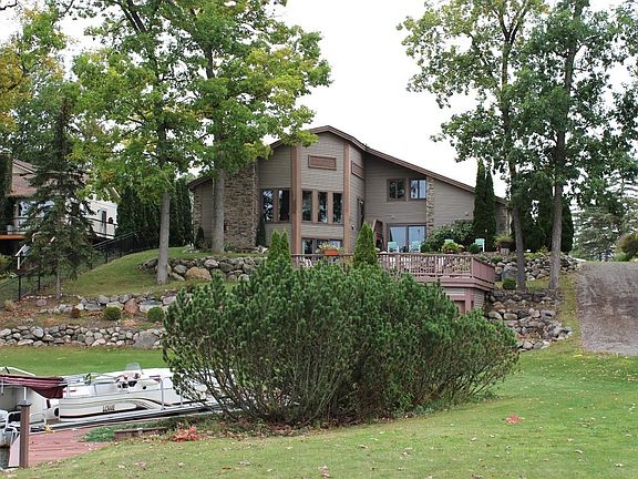 Mature trees and lush landscaping.