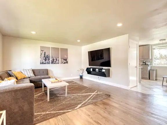 Welcome home! Spacious and open living room with big 75" Smart TV!