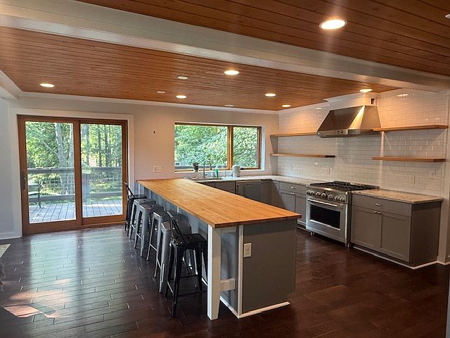Spacious Open Kitchen and deck in the back of the house.
