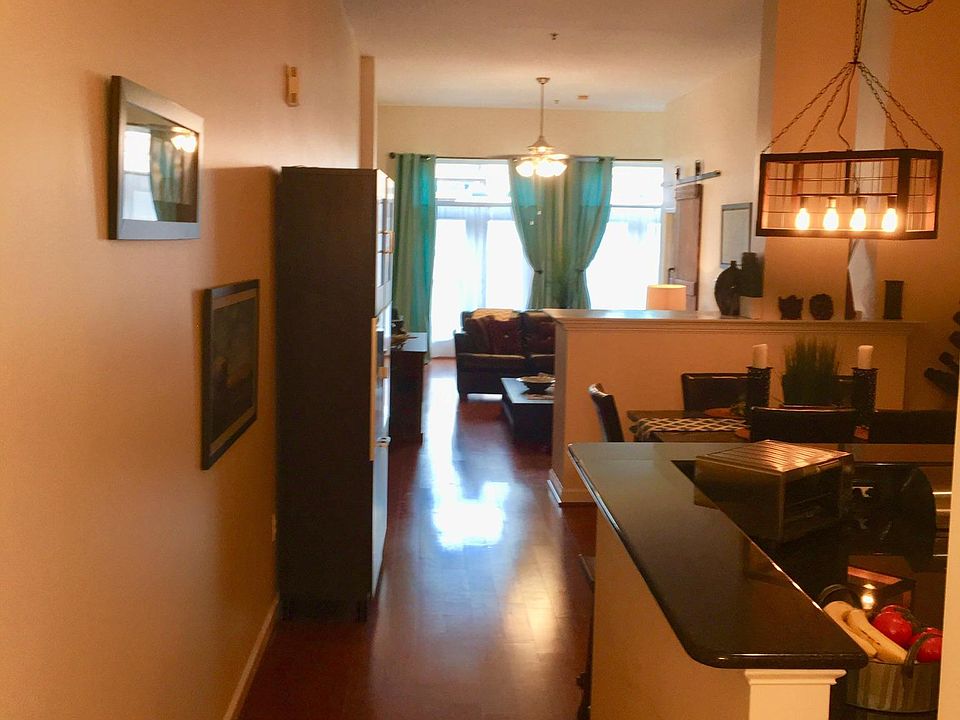 View as you enter the condo! 11' ceilings and warm natural light