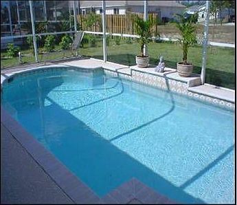 Roman-shaped pool with waterfall feature