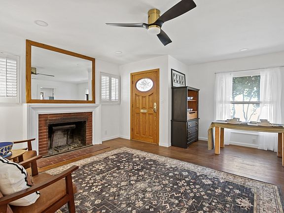 Living Room - Looking out to Maple Street. Large wall mirror adds to the space