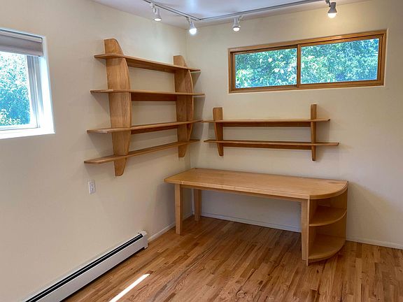 Converted garage comes with custom shelves and table (which can be removed, if you prefer).