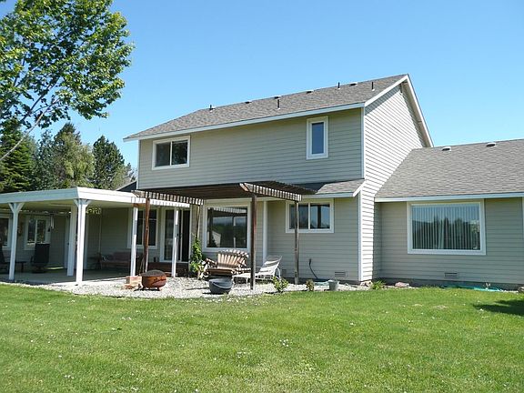back with covered patio and wind break
