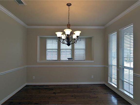 The formal dining room has plenty of room for your holiday gatherings.