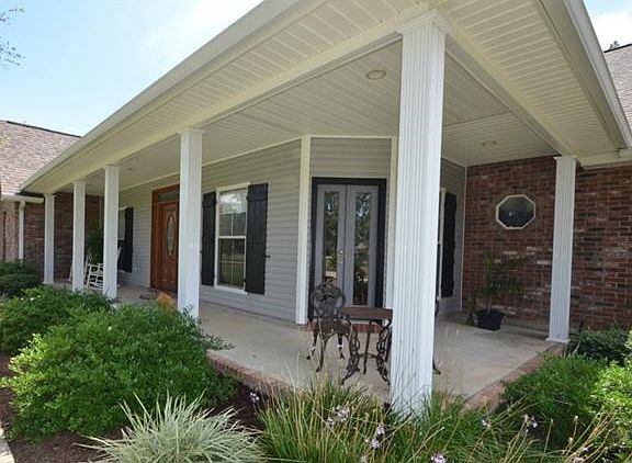 Cozy Wrap-around porch with plenty of sitting room