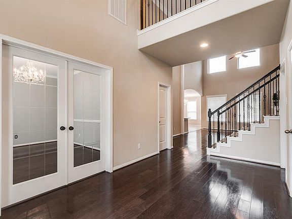 What a view!! This is the Spacious Foyer area with the Gorgeous French Doors leading into the Study/Library!