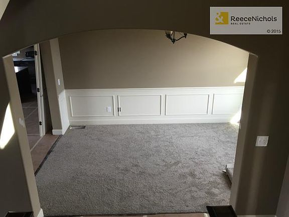 Beautiful Arched Entry to the Dining room.  Wainscoting