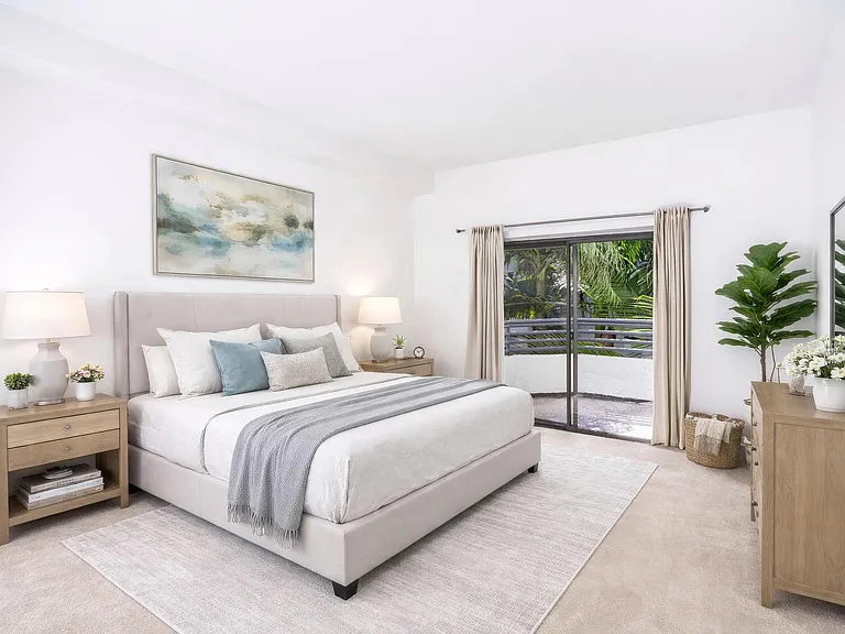 Spacious bedroom with soft finishes, natural light, and select homes with direct access to a private balcony.
