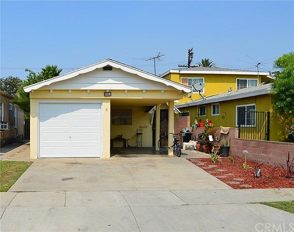Front view of subject property, 1 car garage attached plus carport, driveway fits 3 cars