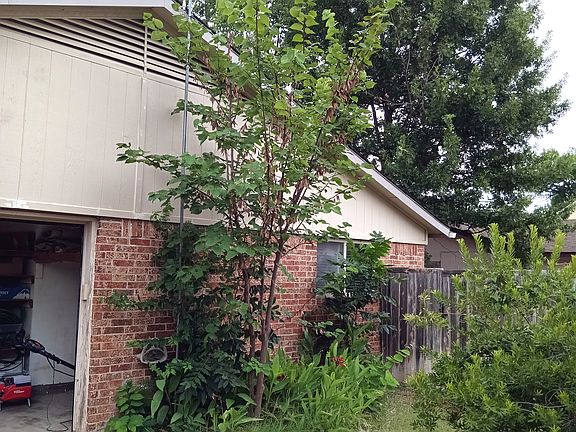 On driveway (back), looking towards house / garage