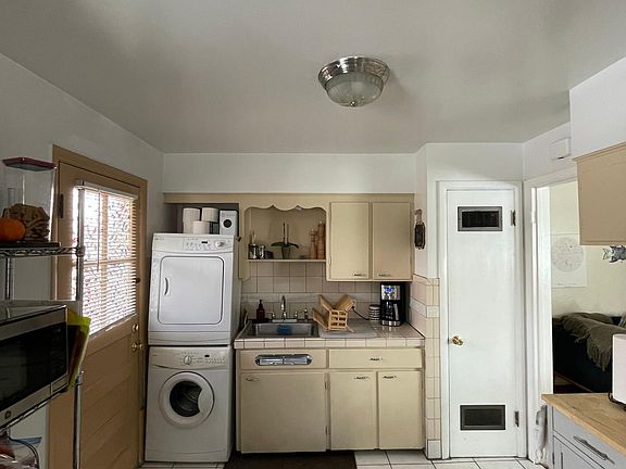 Washer & dryer along with the hot water heater are located in the kitchen but are out of the way.