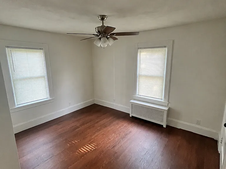 bedroom - new floors, paint and ceiling fan.