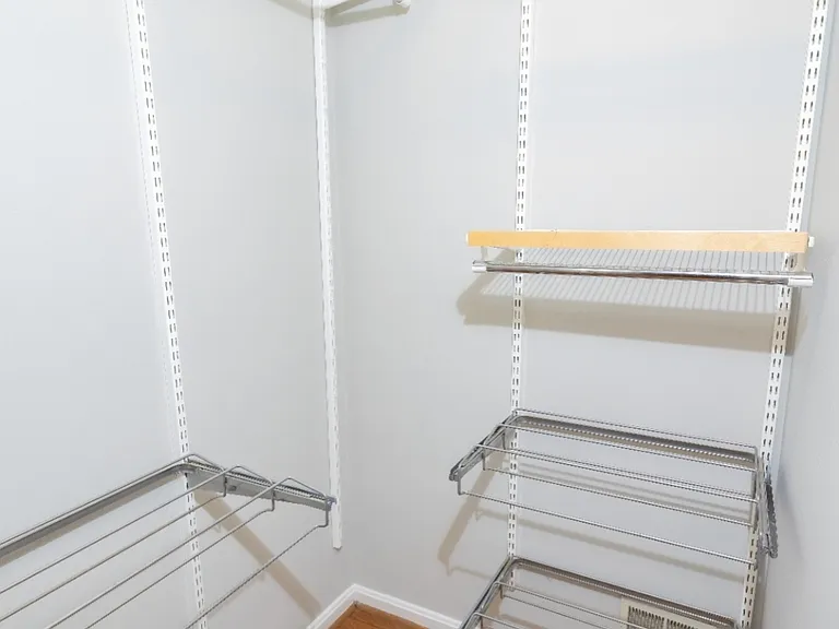 Primary bedroom walk in closet