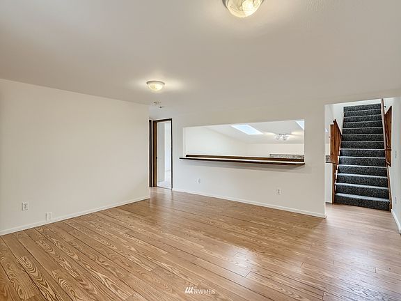 Living room with opening to sunken Family room 