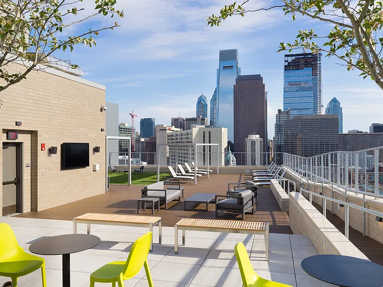 Our rooftop deck features plenty of outdoor seating, a flat screen TV, and breathtaking views of the Philly skyline