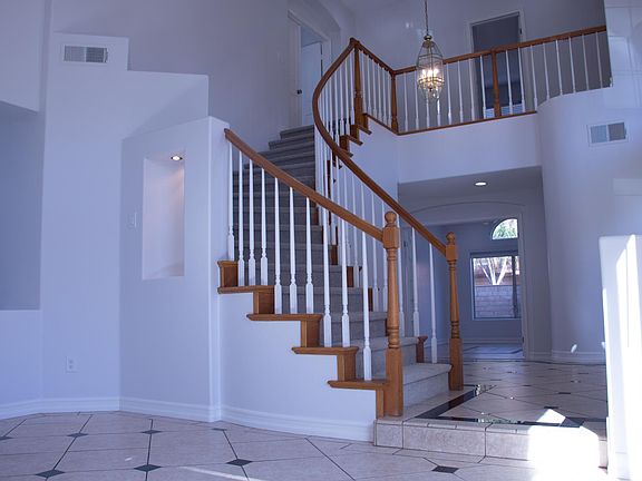 The family room is next to the front entrance and connected to the formal dinning room on the left side.