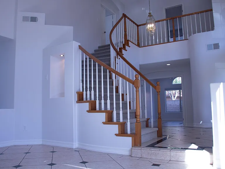 The family room is next to the front entrance and connected to the formal dinning room on the left side.