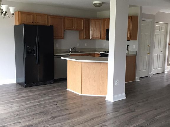 Open floor plan with kitchen, eating area, and family room.