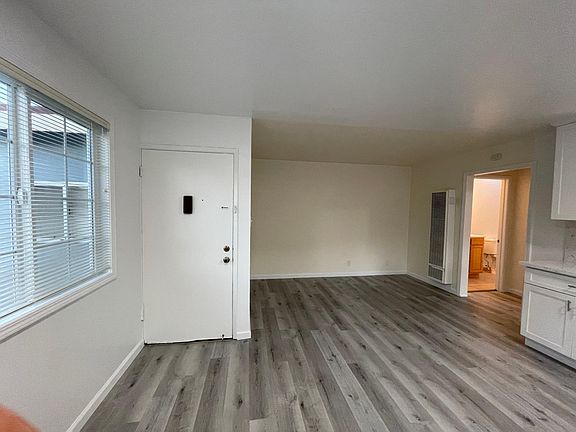 Entrance door and living room beside it.