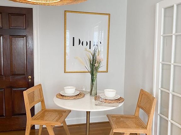 The door to the left of the bistro table hides an ENORMOUS closet!