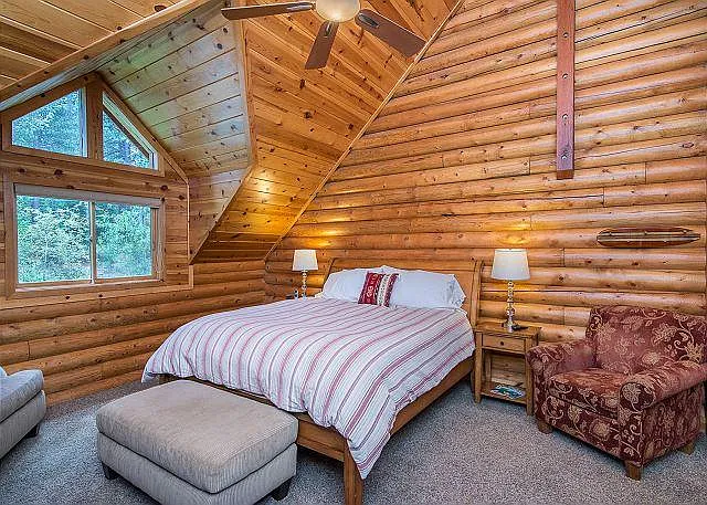 Master bedroom with flat screen TV and large walk in closet.