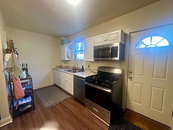 Kitchen with Rear Door to Back Yard and Off Street Parking