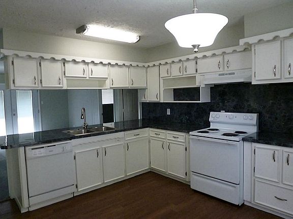 Large Kitchen with new wood like tile New laminate and new paint