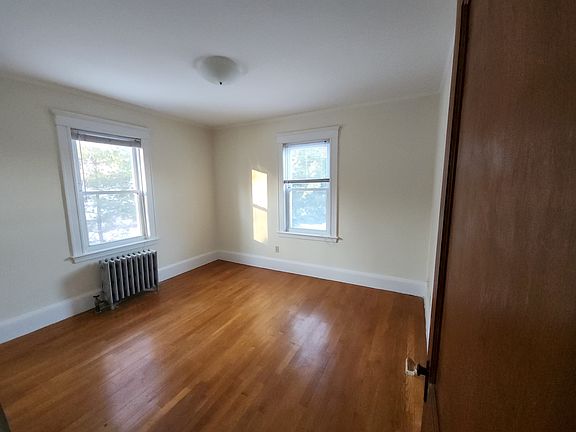 Bed room w/ private backyard views.