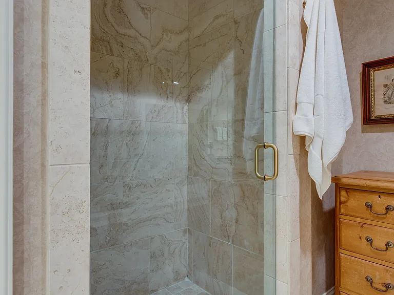 Oversized shower with glass door, oversize tub (not shown)