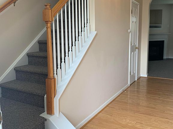 Fresh Berber carpeting leads to 3 bedrooms upstairs
