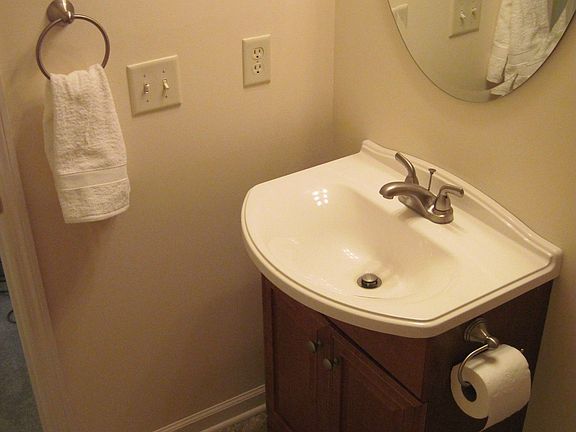 New sink, storage cabinet, mirror, vanity light, fixtures, floor