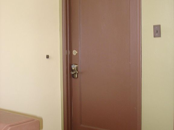 Entry with push button combination code set with personal 4 digit code.