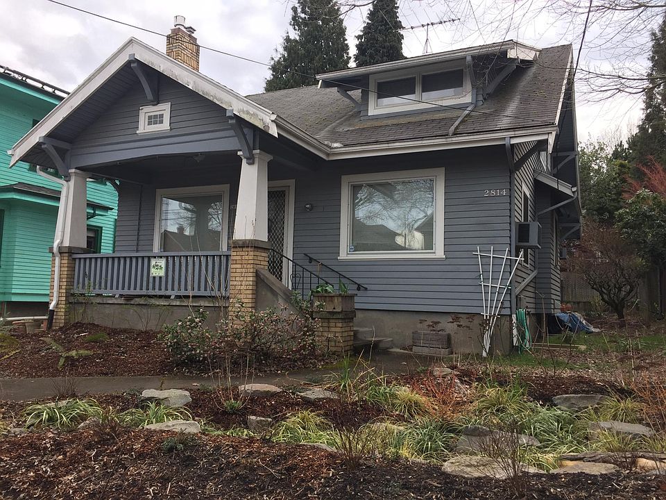 Landscaped yard with native plants and rain garden.