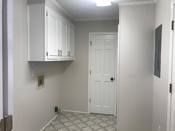 Laundry room/Mud room that connects to half bath