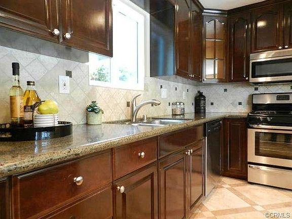 Dining Area off Kitchen with View out to Pool