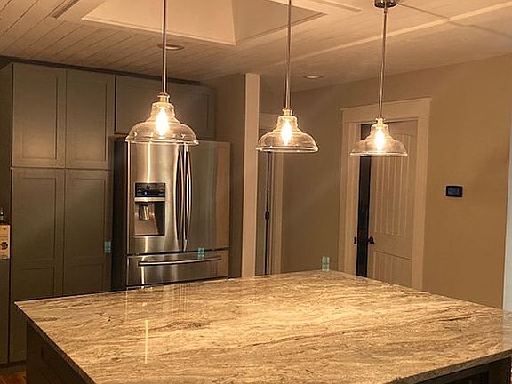 Cozy lighting over island