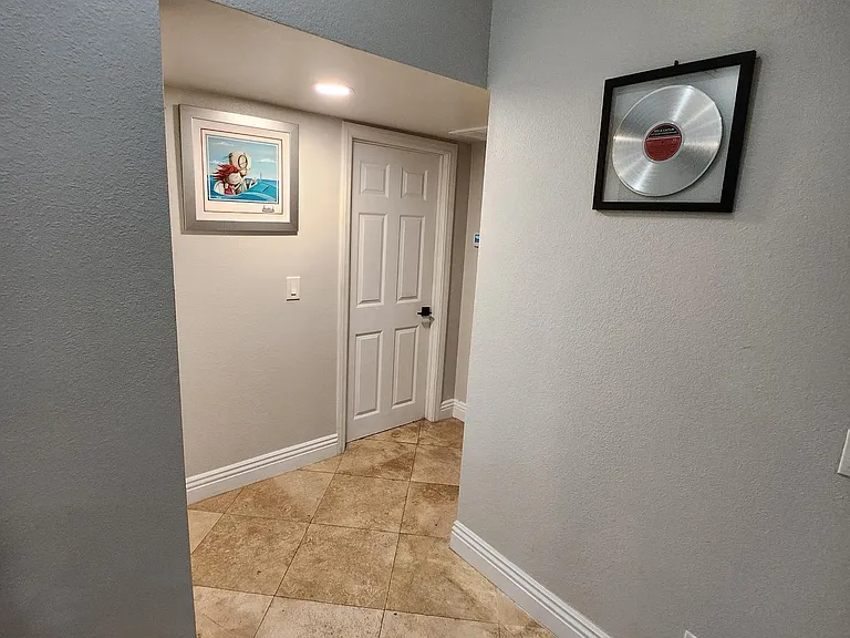 Hallway to 2nd and 3rd bedrooms and guest bathroom