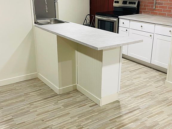 kitchen with countertop seating for 2