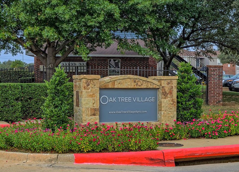 Oak Tree Village Apartments Exterior Front of Building and Sign