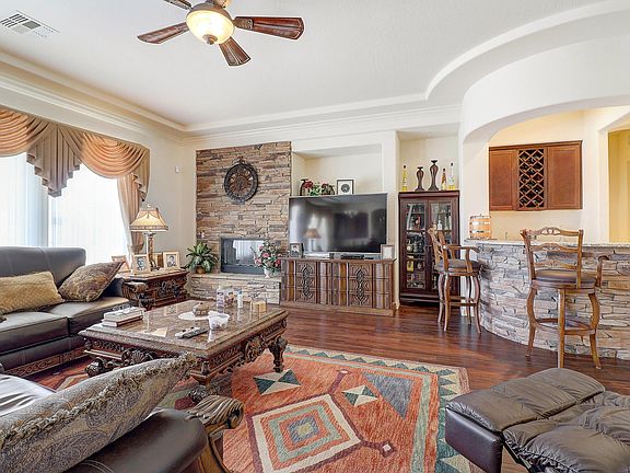 Stacked stone fireplace and custom bar.
