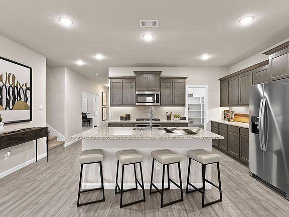 REPRESENTATIVE PHOTO - Kitchen in the Masters II Plus home plan by Trophy Signature Homes