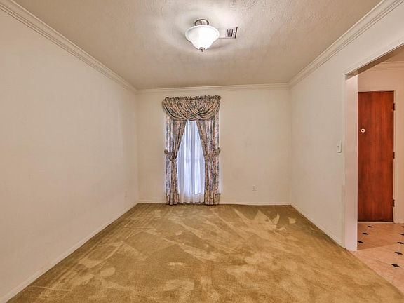 Dining or den area off the the entrance.fresh paint.