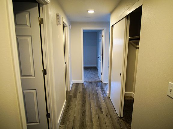 Hallway with entry closet; master bedroom at end